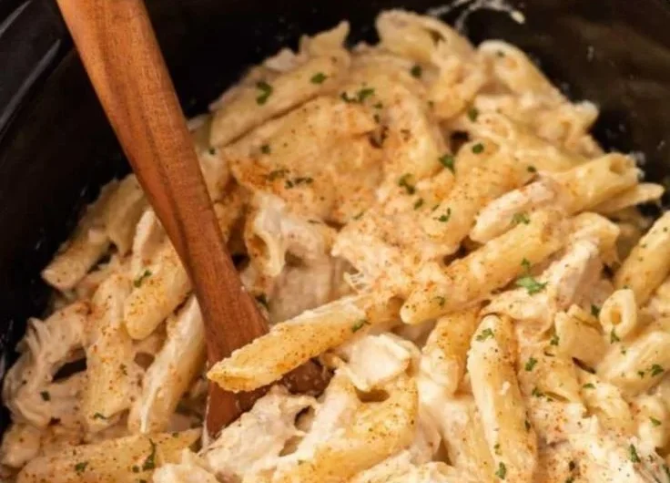 Crock Pot Cajun Chicken Pasta in a creamy sauce served in a bowl
