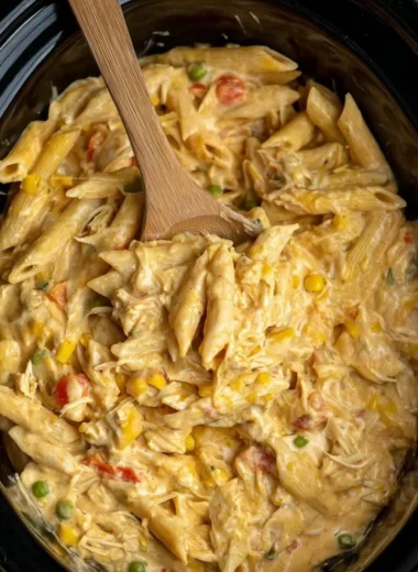 Crock Pot Chicken Pot Pie Pasta served in a bowl, showcasing creamy chicken and vegetables.
