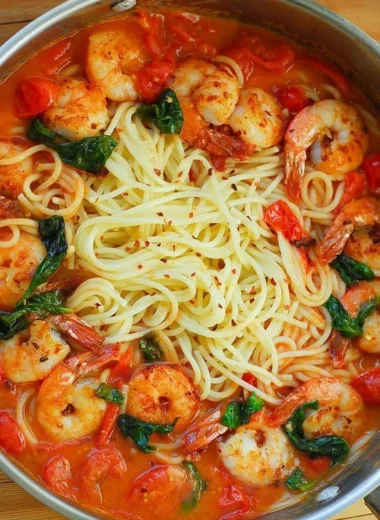 Shrimp pasta with garlic basil tomato sauce served in a bowl