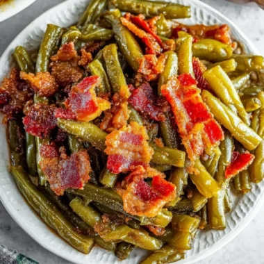 Freshly cooked simple green beans served on a plate.