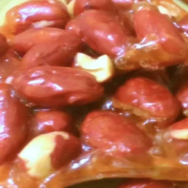 Delicious homemade peanut brittle in a dish ready to enjoy.