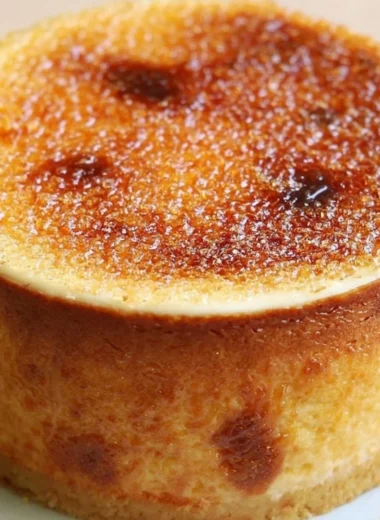 Slice of burnt cream cheesecake with a caramelized top on a plate