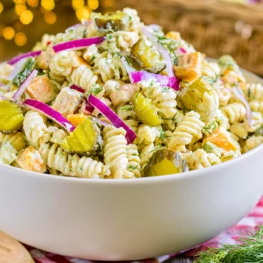 Creamy dill pickle macaroni salad with fresh herbs and pickles