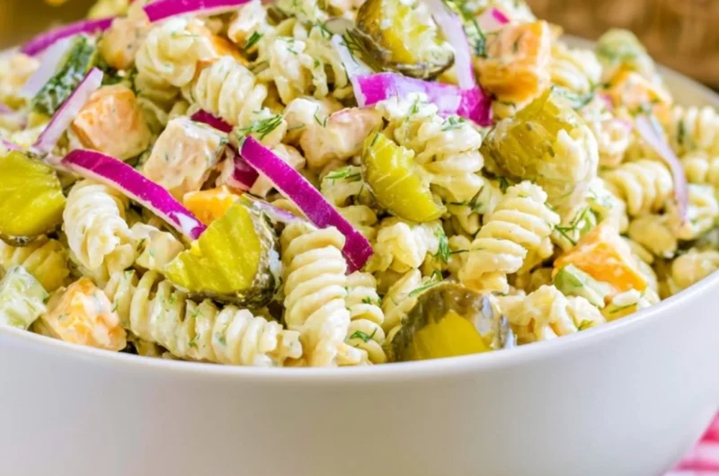 Creamy dill pickle macaroni salad with fresh herbs and pickles