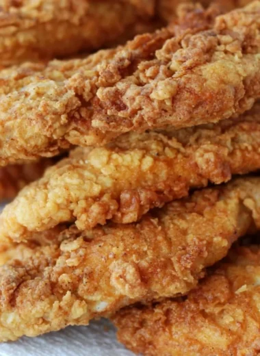 Delicious crispy chicken tenders served with a side of dipping sauce