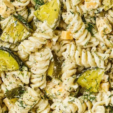 Delicious dill pickle pasta salad served in a bowl with fresh ingredients