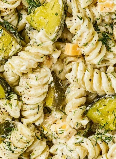 Delicious dill pickle pasta salad served in a bowl with fresh ingredients