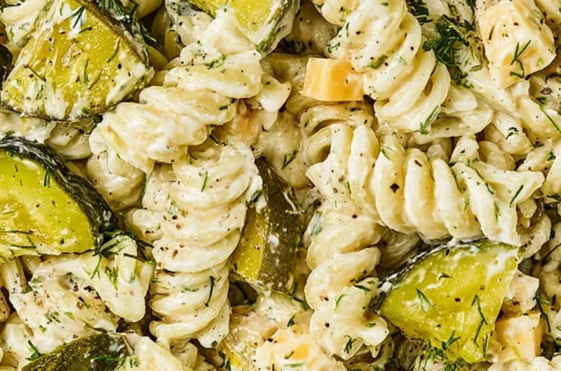 Delicious dill pickle pasta salad served in a bowl with fresh ingredients