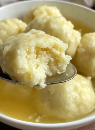 Delicious drop dumplings resting in a warm bowl of soup