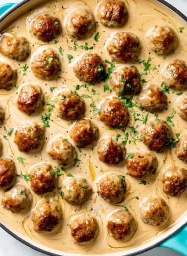 Delicious homemade IKEA meatballs served with gravy and lingonberry sauce