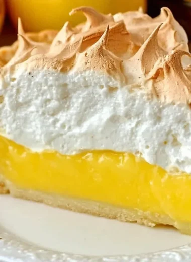 Homemade lemon meringue pie with fluffy meringue topping and zesty filling