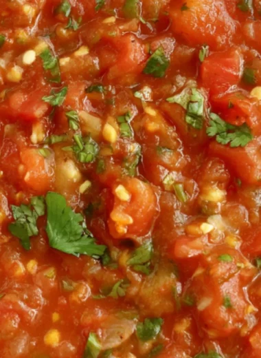 A bowl of vibrant homemade smoked salsa with fresh ingredients and smoky flavor.