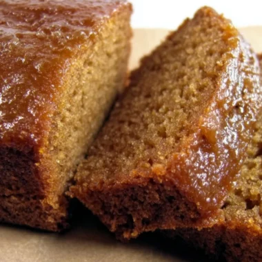 Delicious Honey Applesauce Cake topped with a drizzle of honey