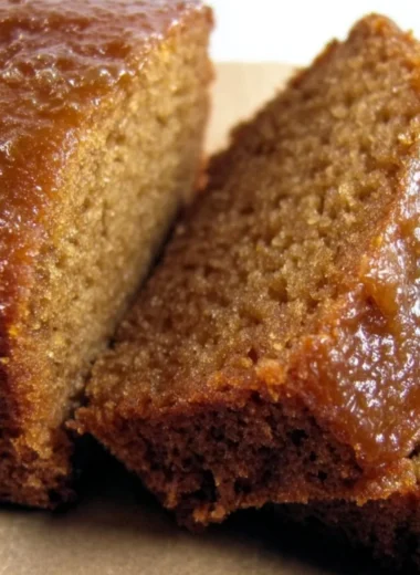Delicious Honey Applesauce Cake topped with a drizzle of honey