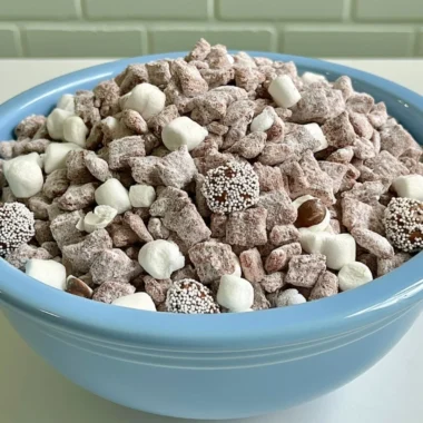 Delicious Hot Chocolate Puppy Chow dessert with chocolate and marshmallows