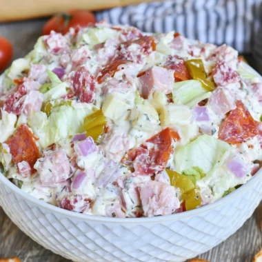 Delicious Italian Hoagie Dip garnished with fresh herbs and served in a bowl.