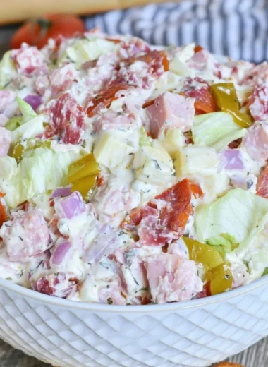 Delicious Italian Hoagie Dip garnished with fresh herbs and served in a bowl.