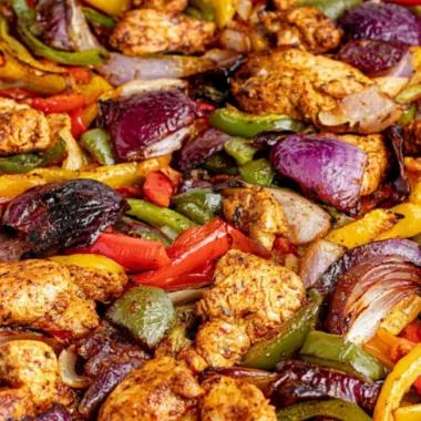 Delicious sheet pan chicken fajitas with colorful peppers and spices.