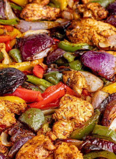 Delicious sheet pan chicken fajitas with colorful peppers and spices.