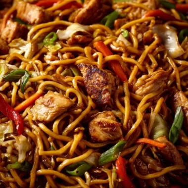 Plate of simple Chicken Chow Mein with vegetables and chicken.