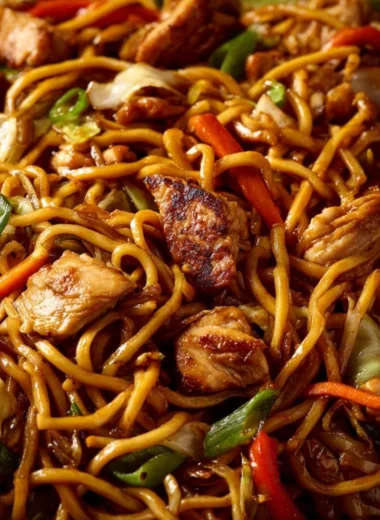 Plate of simple Chicken Chow Mein with vegetables and chicken.