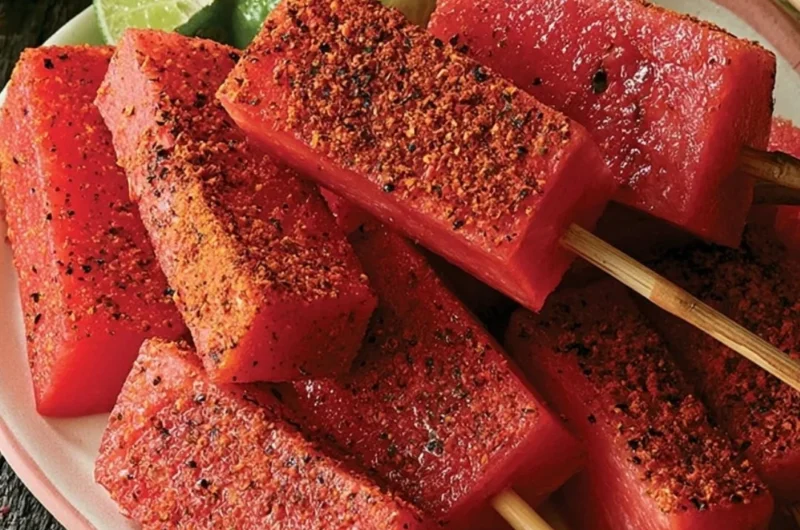 Delicious spicy tequila melon skewers served on a platter.