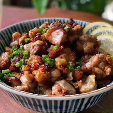 Delicious Yakitori-Inspired Salt and Pepper Chicken Bites on a wooden platter.