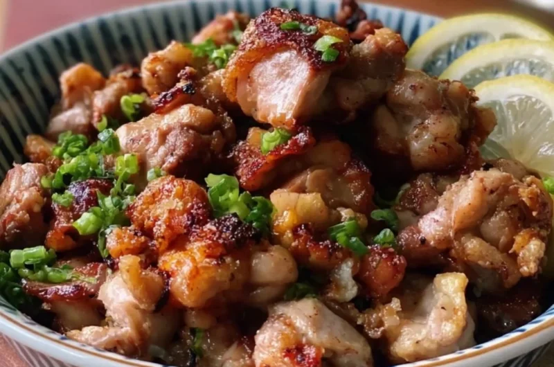 Delicious Yakitori-Inspired Salt and Pepper Chicken Bites on a wooden platter.