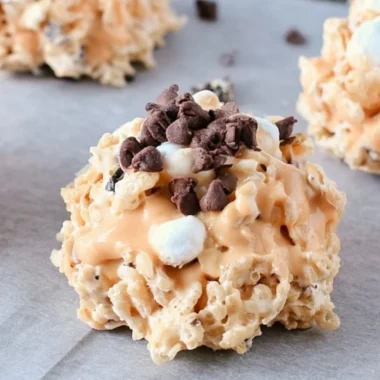 Plate of Avalanche Cookies stacked with marshmallows and chocolate chips