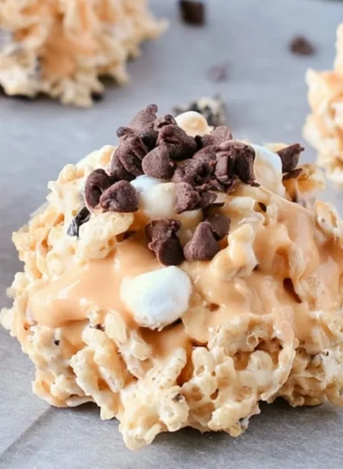 Plate of Avalanche Cookies stacked with marshmallows and chocolate chips