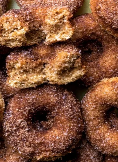 Freshly baked apple cider donuts drizzled with cinnamon glaze