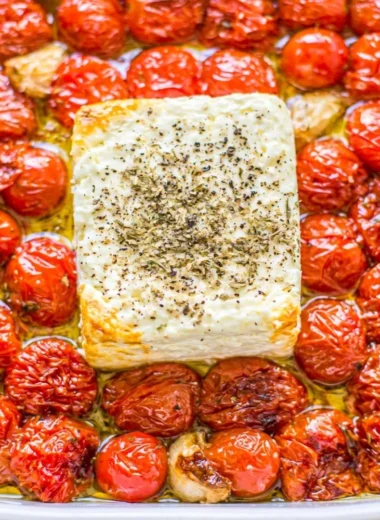 Baked feta pasta with cherry tomatoes served in a bowl