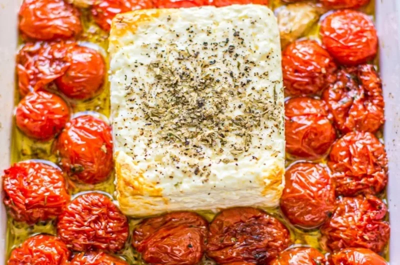 Baked feta pasta with cherry tomatoes served in a bowl