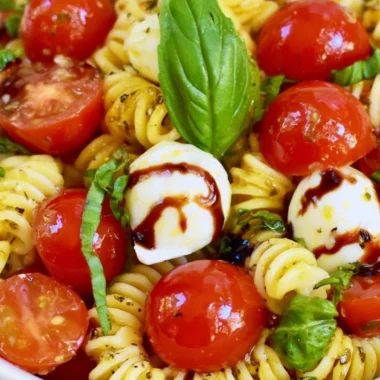 Delicious Caprese Pasta Salad with tomatoes, mozzarella, and basil