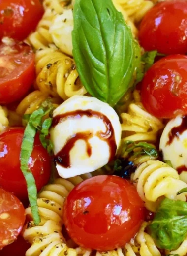 Delicious Caprese Pasta Salad with tomatoes, mozzarella, and basil