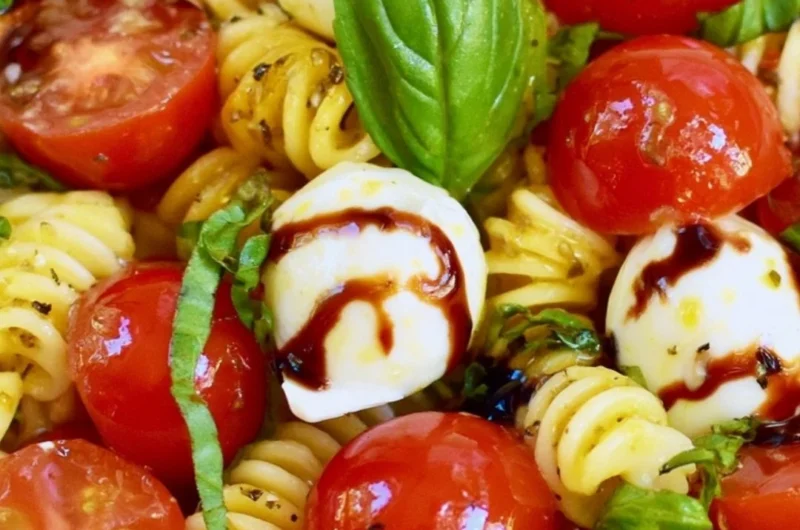 Delicious Caprese Pasta Salad with tomatoes, mozzarella, and basil
