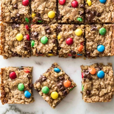 Delicious chocolate chip oatmeal cookie bars freshly baked on a cooling rack.