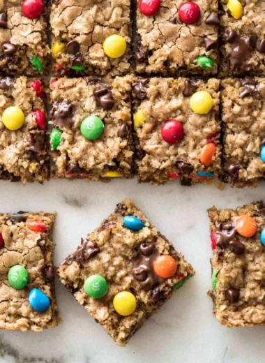 Delicious chocolate chip oatmeal cookie bars freshly baked on a cooling rack.
