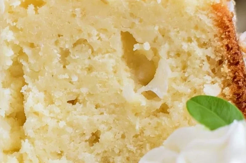 Sliced Coconut Cream Cheese Pound Cake with a tropical garnish