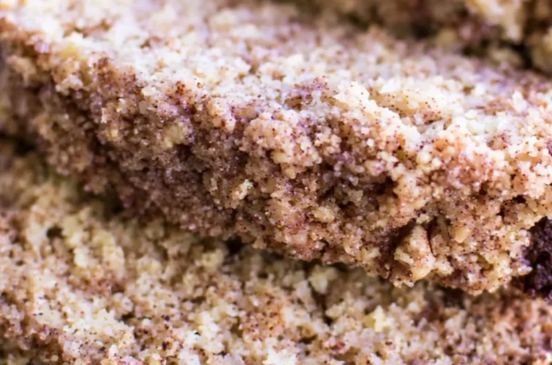 Delicious Coffee Cake Banana Bread slice on a plate with coffee