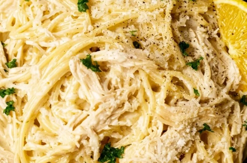 A delicious plate of creamy lemon chicken pasta garnished with herbs