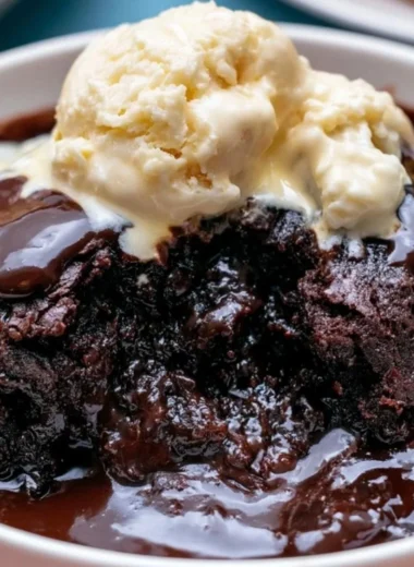 Deliciously rich and fudgy Crockpot pudding brownies in a serving dish