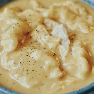 Delicious bowl of the easiest chicken and dumplings topped with fresh herbs