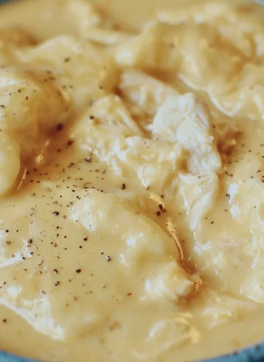 Delicious bowl of the easiest chicken and dumplings topped with fresh herbs