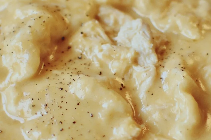 Delicious bowl of the easiest chicken and dumplings topped with fresh herbs