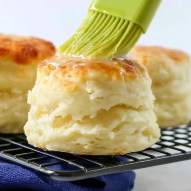 Fluffy homemade self-rising flour biscuits on a baking sheet