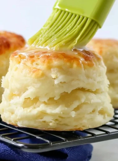 Fluffy homemade self-rising flour biscuits on a baking sheet