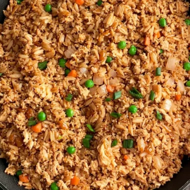 Delicious ground chicken fried rice served in a bowl with vegetables