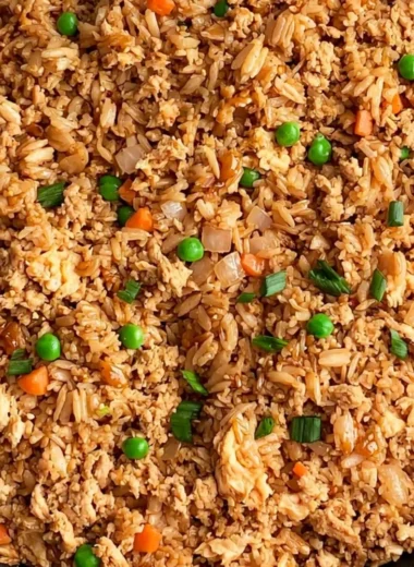 Delicious ground chicken fried rice served in a bowl with vegetables