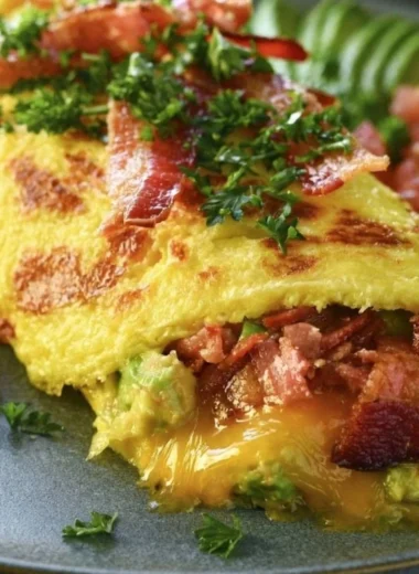 Keto Omelette filled with avocado and bacon for a healthy breakfast